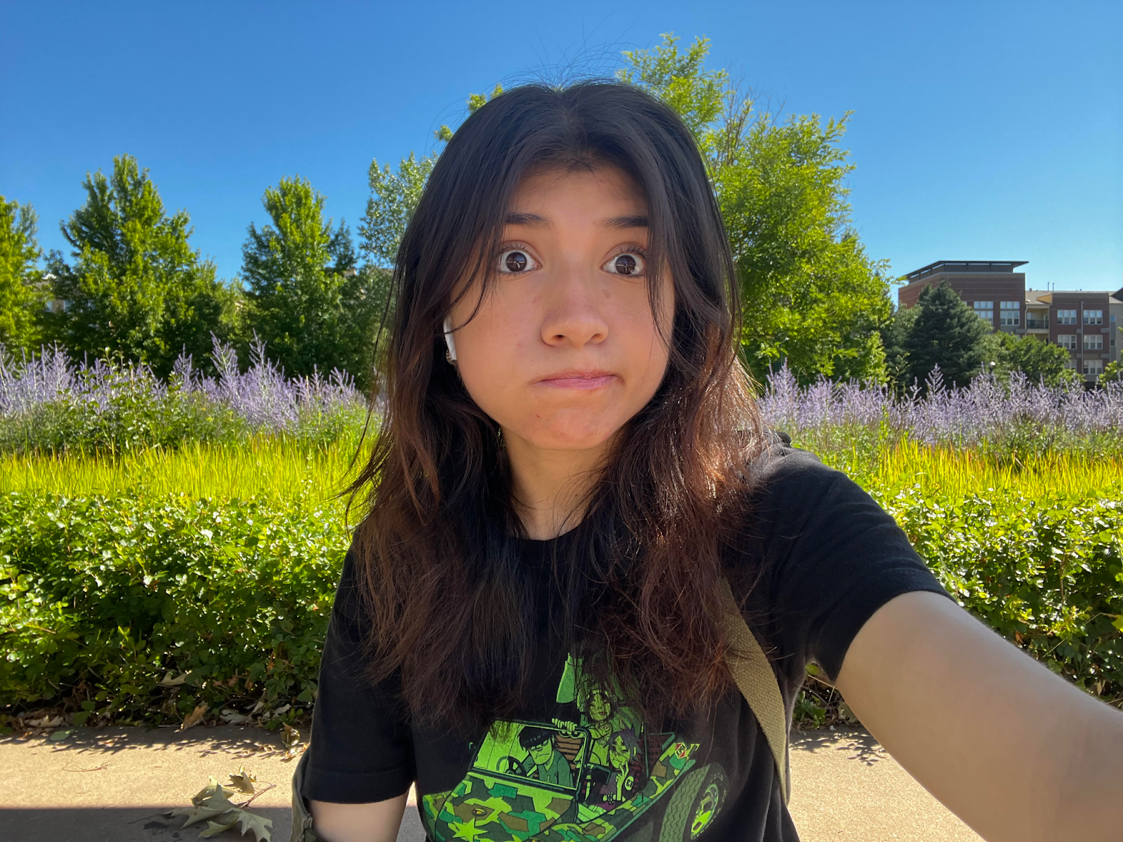 Teen Dae Cabrera making a silly face while taking a selfie outside.